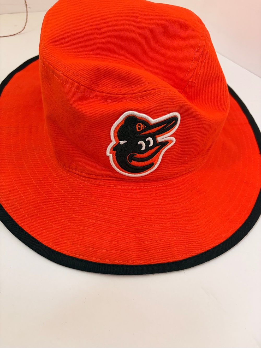Orange Bucket Hat with Black Trim and Embroidered Bird Logo